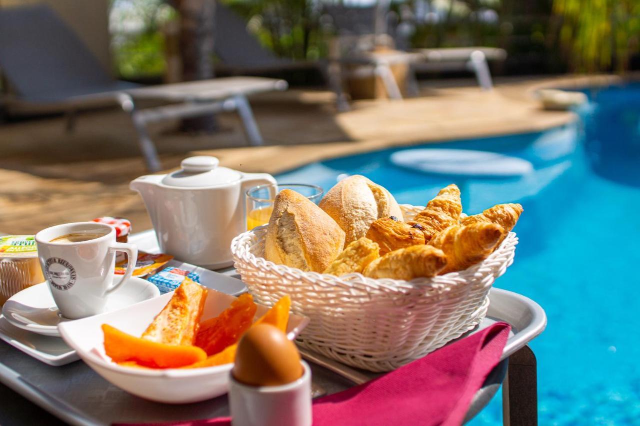 Le Kerveguen Hotel Saint-Gilles-les Bains Bagian luar foto